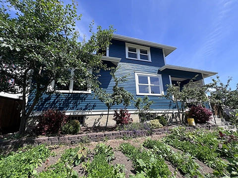 Columbia neighborhood home repaint — lead-safe prep with restored wood trim and windows.