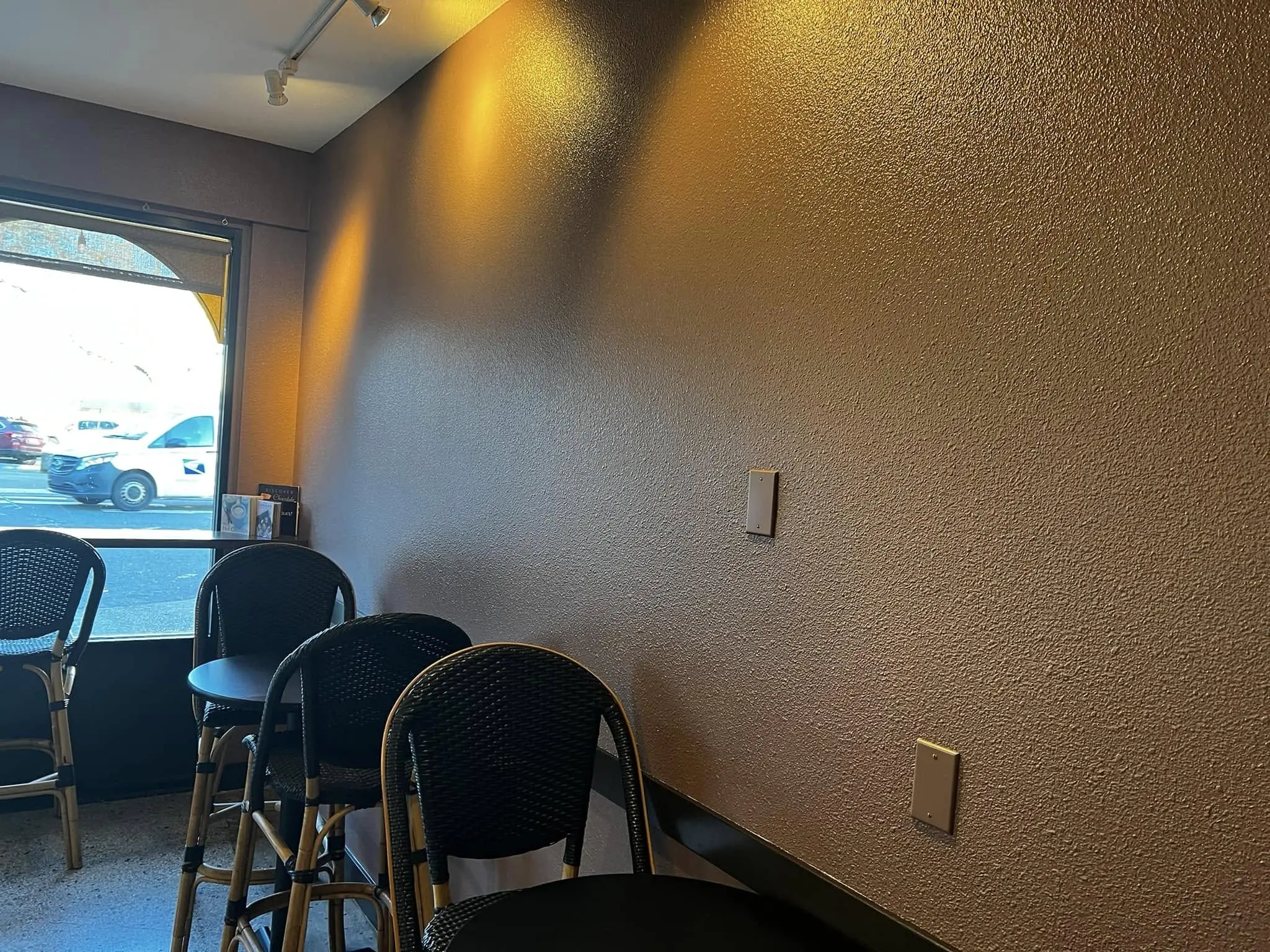 Commercial interior repaint at Chocolate Necessities in downtown Bellingham — Benjamin Moore Aura custom chocolate wall color.